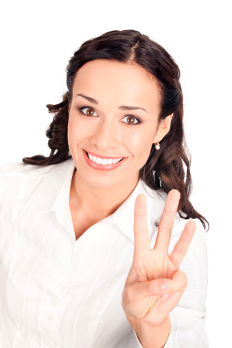 Happy smiling young business woman showing three fingers, isolated on white background