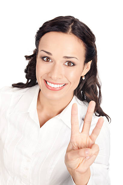 Businesswoman showing three fingers, on white stock photo