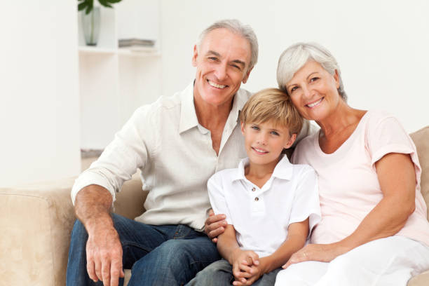 istock Smiling Senior Couple And Young Boy 153031691