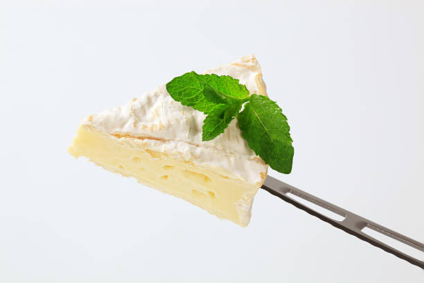 istock camembert cheese on a knife-point 153032931