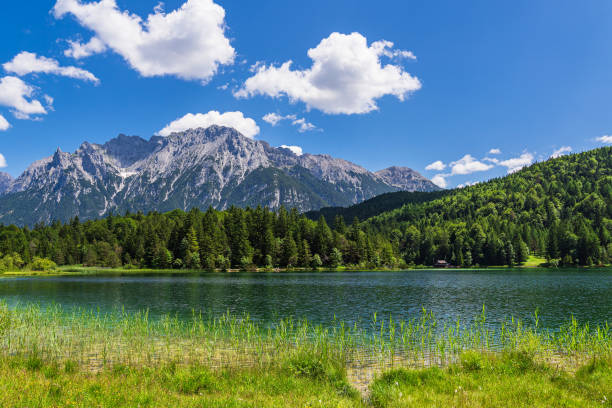 view over the lautersee lake to the karwendel mountains near mittenwald, germany - lautersee lake imagens e fotografias de stock