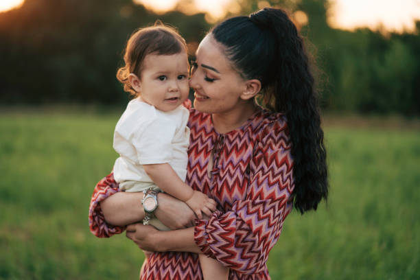 istock Mother enjoying the day in nature with her child 1530366421