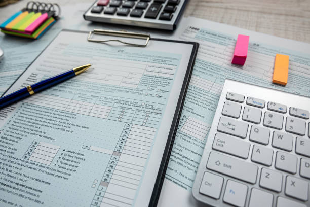 istock paperwork and deadline tax form 1040 with keyboard as online work 1530371382