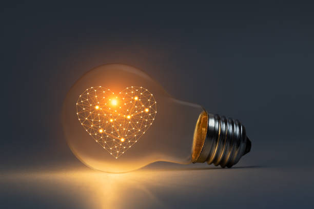 Artificial intelligence love concept with glowing light bulb stock photo