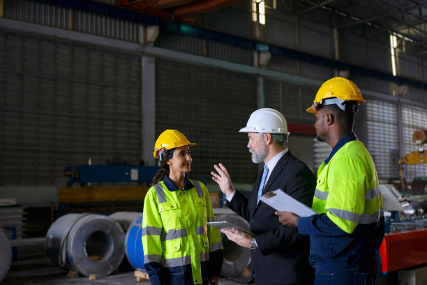 Engineer at metal sheet factory. stock photo