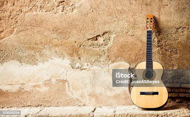 Spanish Guitarr On Wall Stock Photo - Download Image Now - Acoustic Guitar, Brick Wall, Brown