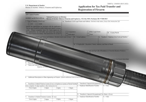 istock Silencer with shadow on the public domain tax form for ownership 1530383579