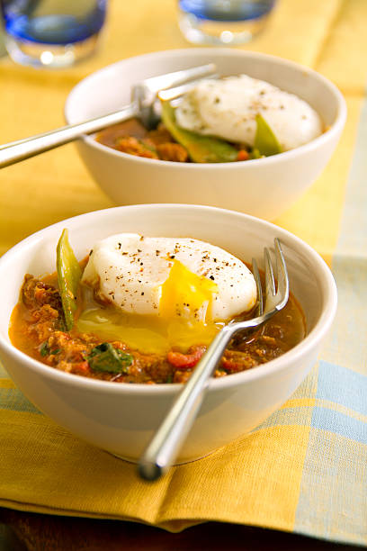 Curried Lamb Hash with Poached Eggs stock photo