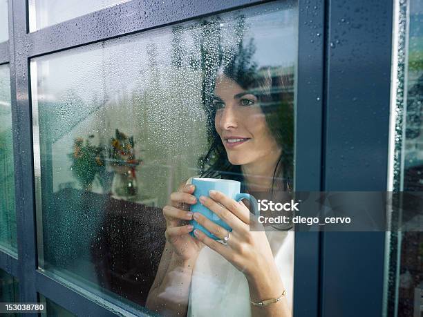 Woman Staring At The Window Stock Photo - Download Image Now - Rain, Window, Domestic Life