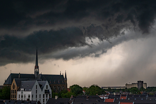 Storm clouds over Zwolle during a summer thunderstrom at the end of a warm and humid summer afternoon. A shelf cloud is approaching over the rooftops and the Dominicanenklooster.