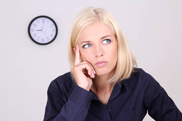 istock tired businesswoman at work 153040696