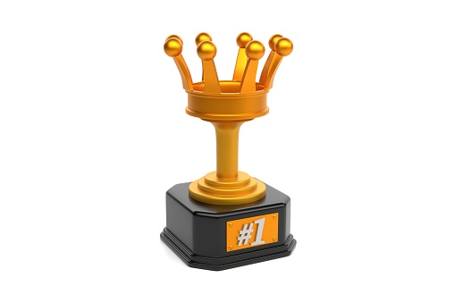 Gold coloured trophy with a crown and the number 1 on it's plaque - isolated on a plain white background 3D render