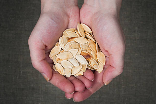 istock Handful of pumpkin seeds 153041272