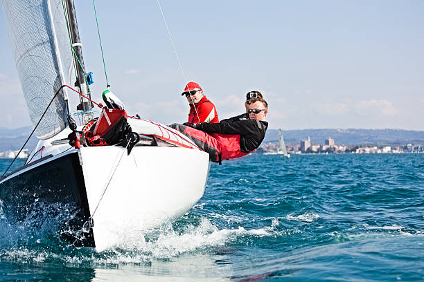 Men enjoying the sport of sailing sport sailing, motion image, copy space mast sailing photos stock pictures, royalty-free photos & images
