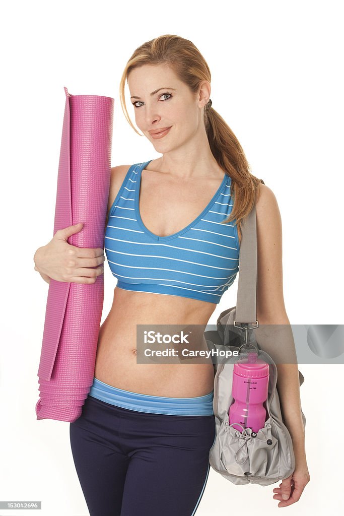 fit woman with workout gear fit woman with yoga mat and gym bag, isolated on white 30-39 Years Stock Photo