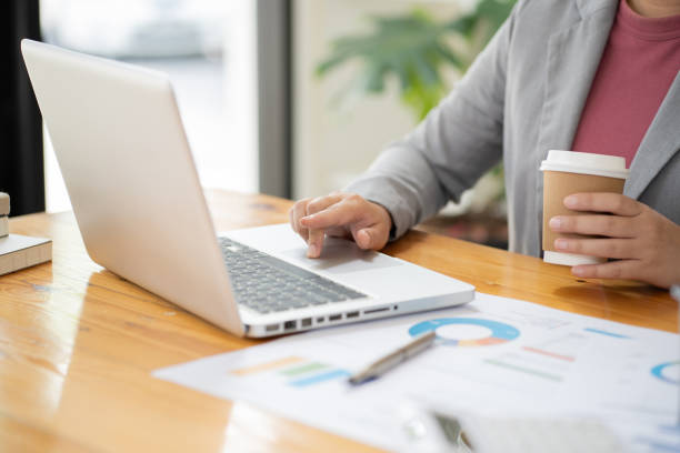istock Business Woman working by using laptop computer Hands typing on a keyboard. Professional investor working new start up project. business planning in office. Technology business Concept 1530427258