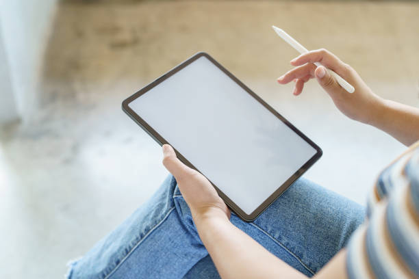 istock Woman holding blank screen on digital tablet device. technology background tablet with blank empty screen. 1530427260