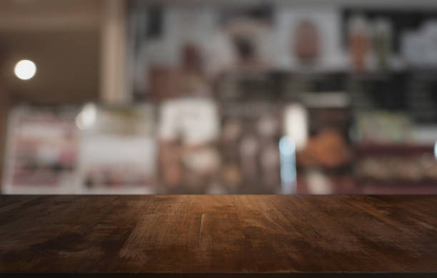 istock Wood Table Top in Blur Background room interior with empty copy space. 1530427417