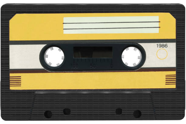 istock Black audio cassette with a yellow label. 1530427517