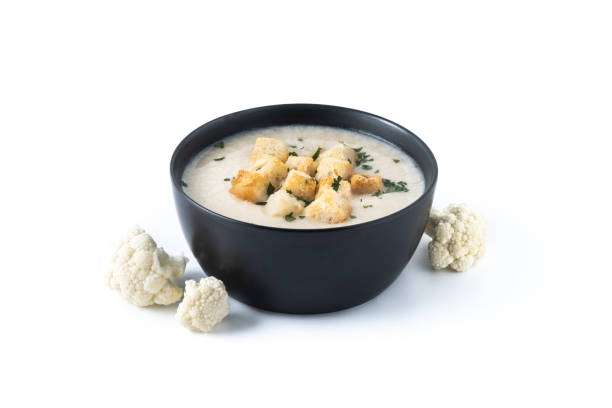 istock Cauliflower soup in a bowl isolated on white background. 1530428031