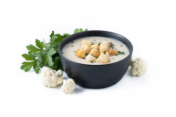 istock Cauliflower soup in a bowl isolated on white background. 1530428046