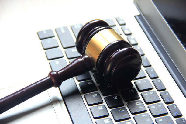 Gavel on laptop computer Gavel on laptop computer gavel keyboard stock pictures, royalty-free photos & images