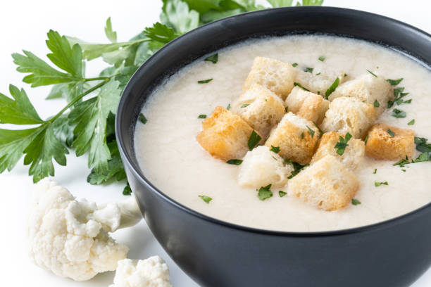 istock Cauliflower soup in a bowl on wooden table 1530428203
