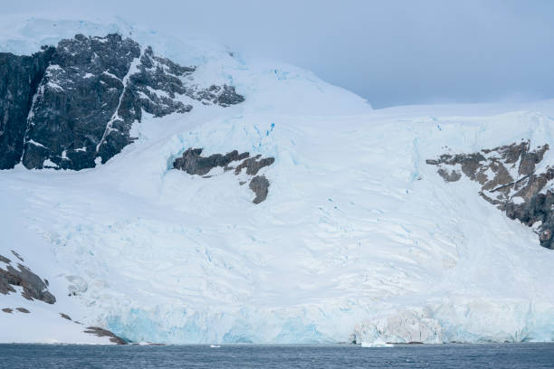 istock Antarctica mountains and sea. South Pole. On cloudy day 1530450013