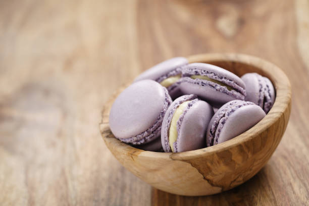 istock violet macarons in wood bowl on wooden table angle view 1530460649
