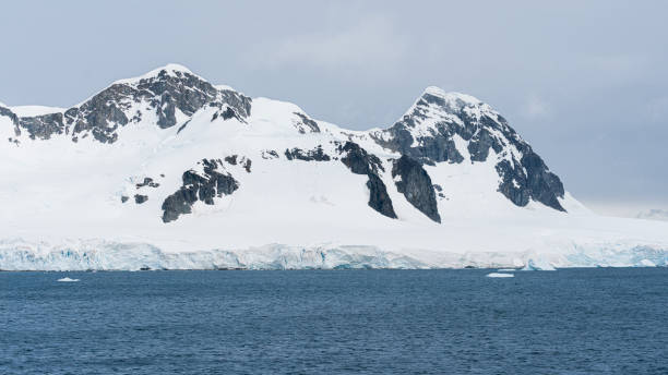 istock Antarctica mountains and sea. South Pole. On cloudy day 1530466528