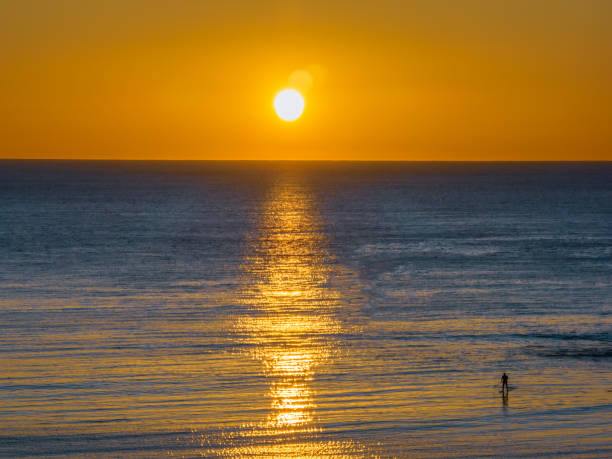 istock Sunrise over the ocean with clouds 1530468627
