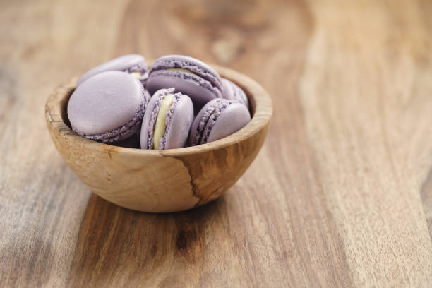 istock violet macarons in wood bowl on wooden table 1530470248