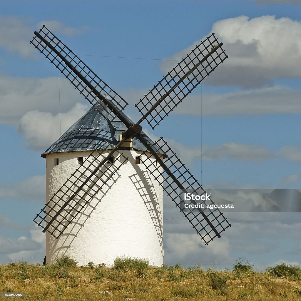 Medieval windmill Medieval windmills dating from the 16th century on the hill of Campo de Criptana in Castilla La Mancha, Spain. In the novel, Don Quixote fights windmills that he imagines to be giants. Quixote sees the windmill blades as the giant's arms, for instance Architecture Stock Photo