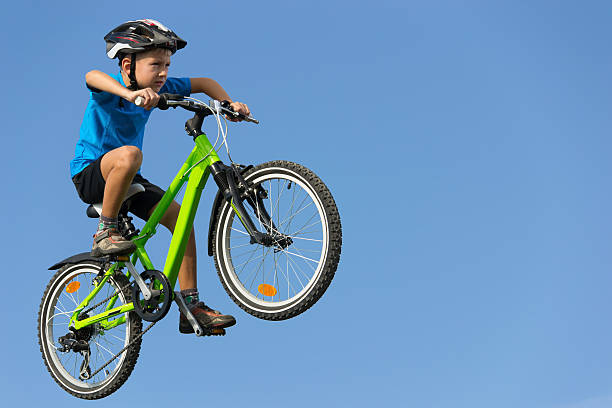istock Boy jumping on bike 153049518