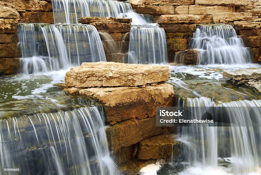 Waterfall Beautiful cascading waterfall over natural rocks, landscaping element Beauty In Nature Stock Photo