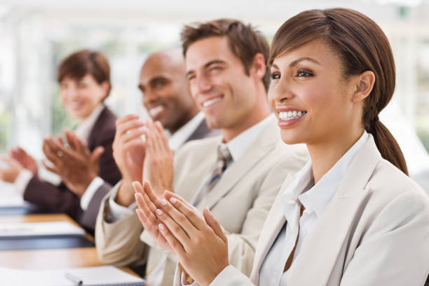 istock Closeup of happy businesspeople clapping 153050794