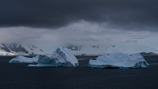 Mountain view in Antarctica on cloudy evening. High quality photo