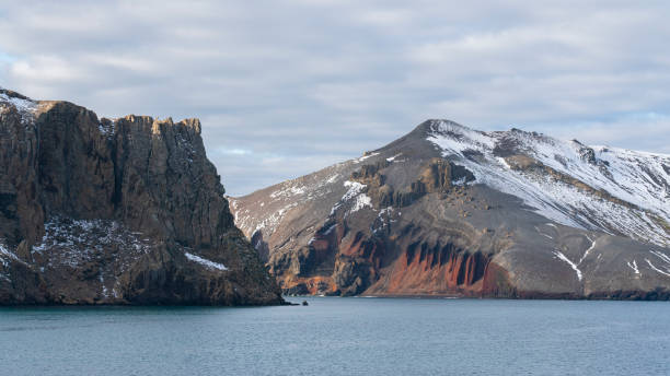 istock Rugged mountains with a dusting of snow at Deception Island, Antarctica 1530555567