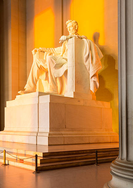 istock Sun at dawn illuminates Lincoln statue 153055624