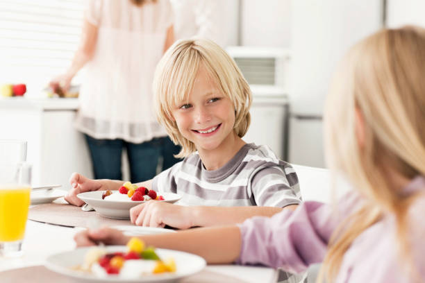 istock Young Brother and Sister Having Breakfast 153056159