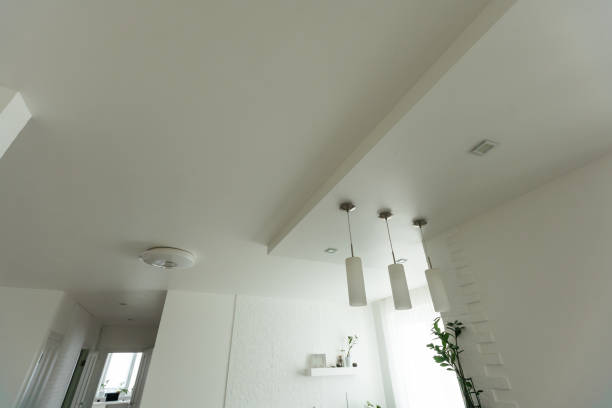 Clean gypsum board ceiling in construction site. Under construction a new house with interior modern style. High quality photo
