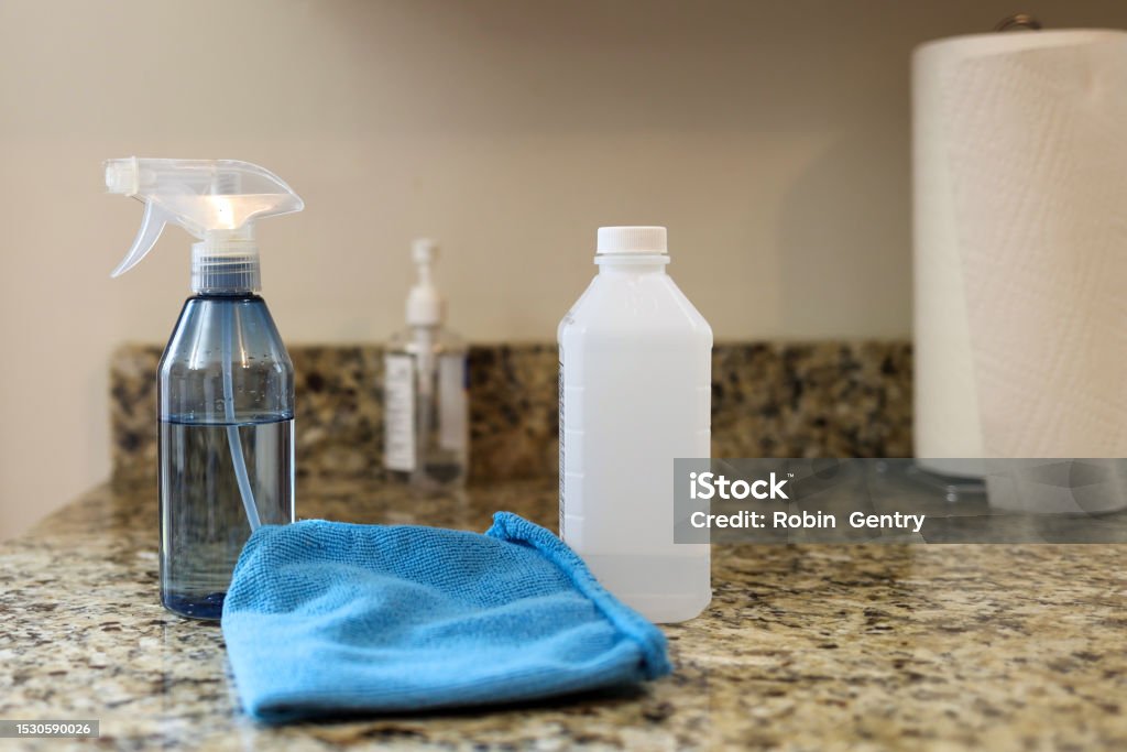All purpose cleaner disinfectant spray bottle with towel Rubbing Alcohol Stock Photo