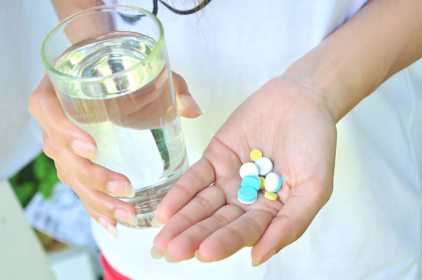 istock Take medicine and water 153060560