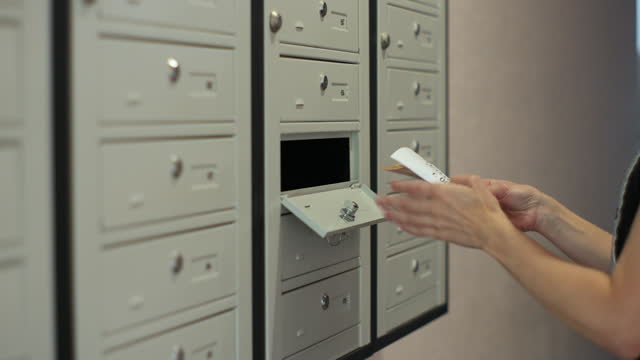 Young woman checking mailbox. Opening postbox and taking refusal notification in apartment. Mail delivery and post service, online shopping, e commerce concept.