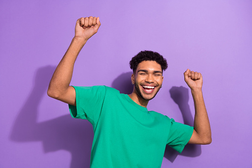 Photo of positive carefree person enjoy dancing partying good mood isolated on violet color background.