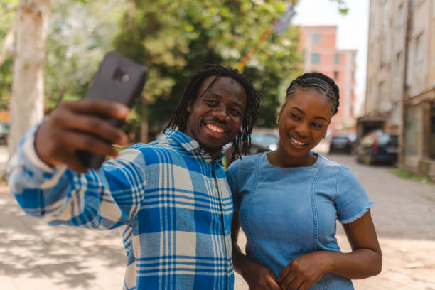 istock Two young black friends taking a selfie outdoors 1530626241