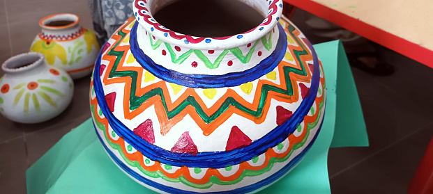 Generic earthen pot painted in vibrant colours