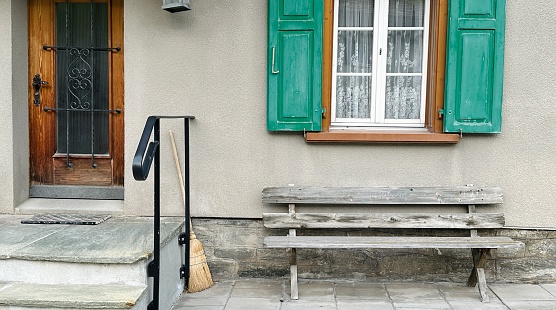 Typical Swiss House entrance with broom