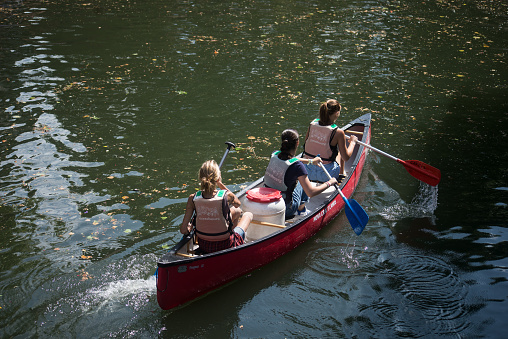 Strasbourg - France - 8 July 2023 - Portrait on back view of people in canoe kayak at little france quarter