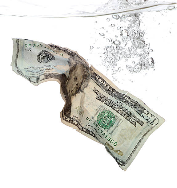istock 20 Dollar banknote in water 153065240